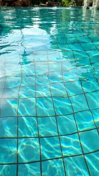 Reflection in a bright blue swimming pool Stock Photos