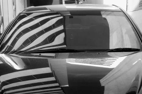Reflection of building and sky on the car Ilustración de archivo