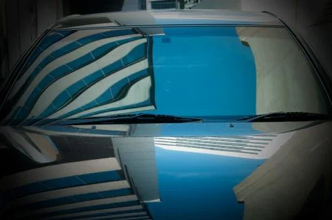 Reflection of building and sky on the car Ilustración de archivo