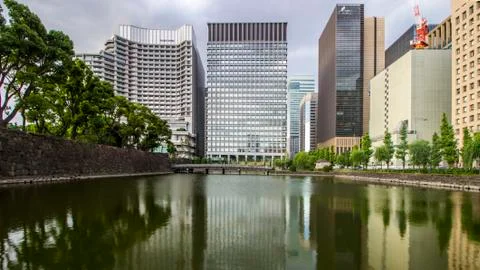 Reflection of building and tree on canal Stock Photos