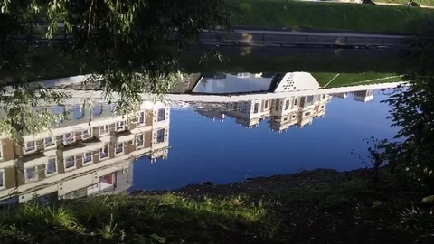 Reflection of a building in a river 스톡 동영상 79618595