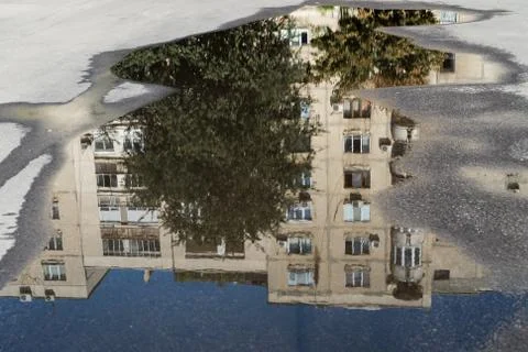 Reflection of a building in a street puddle 写真素材