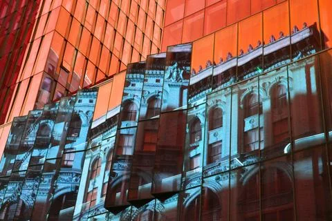 Reflection of a building in the windows of a modern office building Stock Photos