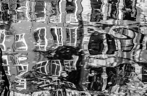 Reflection of the buildings along the canal in Amsterdam, the Netherlands Stock Photos