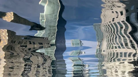 Reflection of buildings in middle dock canary wharf london docklands in summer Stock Footage 204138665