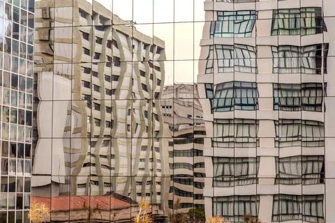 Reflection of buildings in windows of another building with a cubist painti.. Stockfoto's