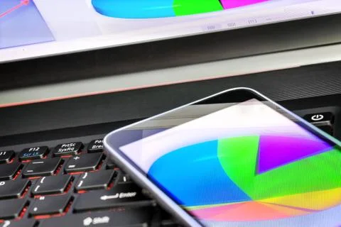 Reflection of  business graph on smartphone Stock Photos