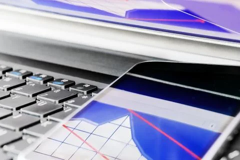 Reflection of  business graph on smartphone Stock Photos