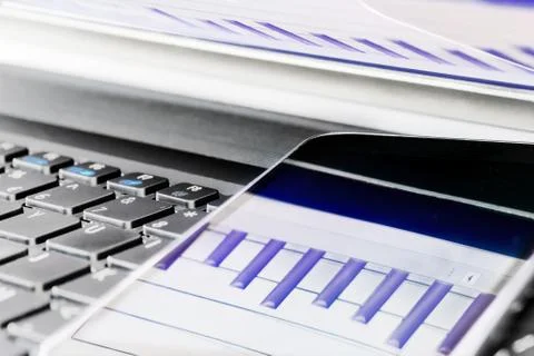 Reflection of  business graph on smartphone Stock Photos