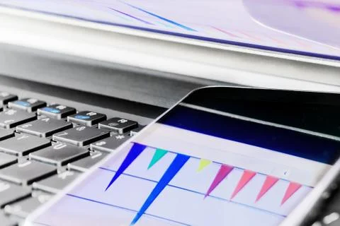 Reflection of  business graph on smartphone Stock Photos