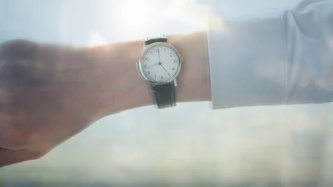 Reflection of a businessman checking the time Video stock 85122588