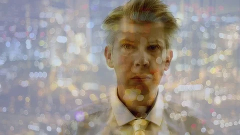 Reflection of a businessman looking at a city at night Video stock 80746518