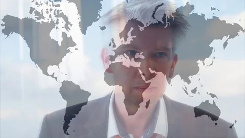 Reflection of a businessman looking at an image of the world Video stock 80932452