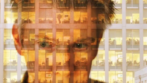 Reflection of a businessman looking at a modern office at night Video stock 104256594