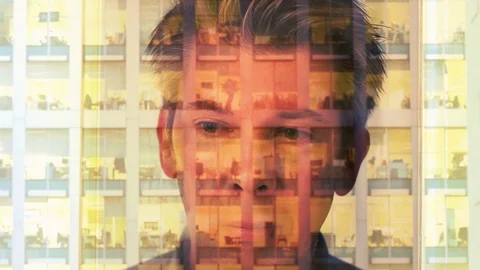 Reflection of a businessman looking at a modern office at night Video stock 104257341