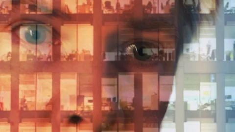 Reflection of a businessman looking at a modern office at night Video stock 104258784