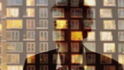 Reflection of a businessman looking through a window Video stock 80166666
