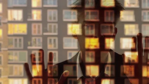 Reflection of a businessman looking through a window Video stock 80167400