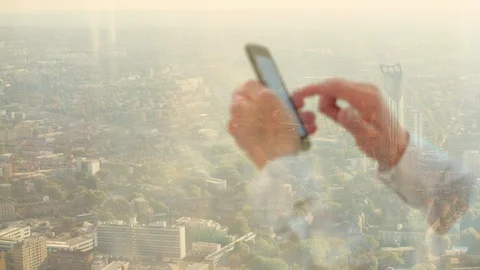 Reflection of a businessman on the phone Video stock 85776913