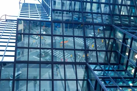 Reflection busy traffic intersection in urban environment Stock Photos