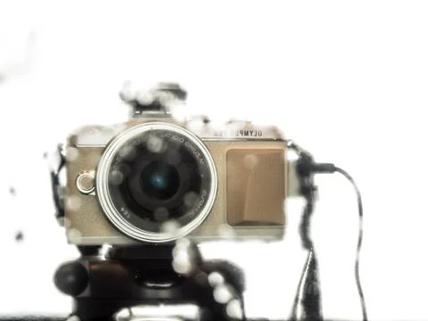 Reflection of a camera in a wet mirror in room Stock Photos