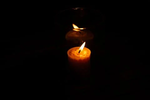 The reflection of a candle in the dark Fotos de archivo