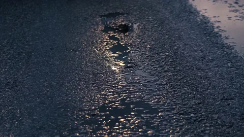 Reflection car headlights in wet asphalt and puddle, road safety concept. Stock Footage 152009920
