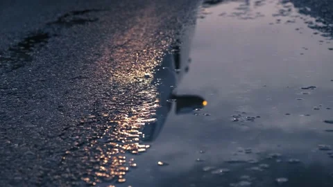 Reflection car headlights in wet asphalt and puddle, road safety concept. Video stock 152010318