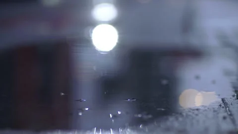 Reflection Car Headlights In Wet Asphalt And Puddle Stock Footage 255284175