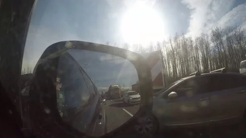 Reflection in the car mirror while driving timelapse video Stock Footage