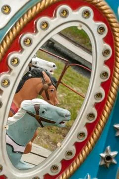 Reflection of carousel horses Stock Photos