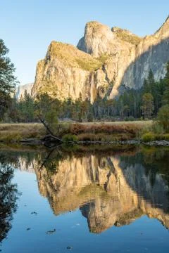 The reflection of Cathedral Peak on the Merced River from the Yosemite Valley Stock Photos
