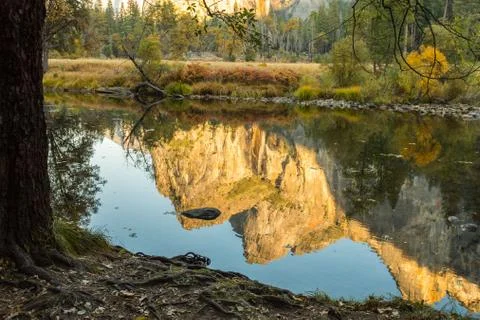 The reflection of Cathedral Peak on the Merced River from the Yosemite Valley Stock Photos
