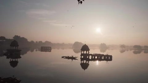 Reflection of the cenotaphs or Chhatri pavilion in the  gadisar lake Jaisalmer Stock Footage 282791298