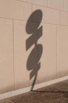 Reflection of circle and rectangle shaped road signs on a wall 스톡 사진