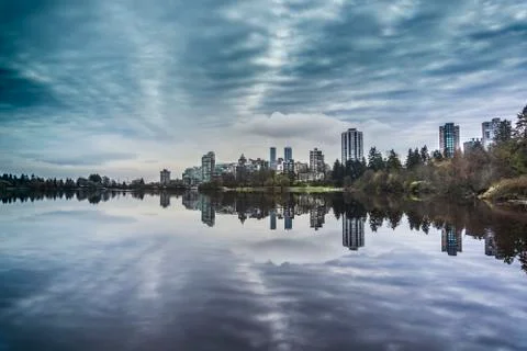 Reflection of city and clouds Stock Photos