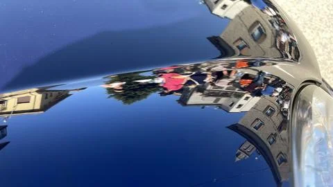 Reflection of the city in the mirror of a car Stock Photos