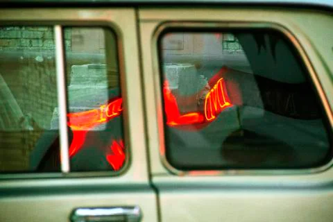Reflection of the city in a passing car. Stock Photos