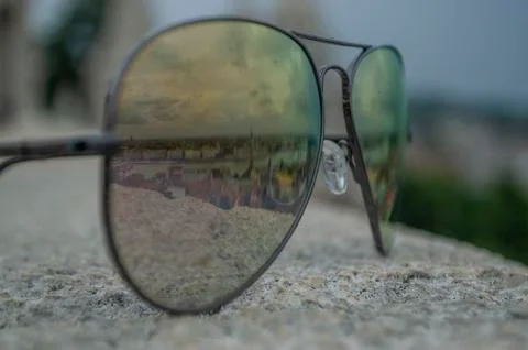 Reflection of city from a top historic elevated landmark through the sunglass Stock Photos