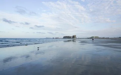Reflection of cloud pattern on low tide wet sand Stock Photos