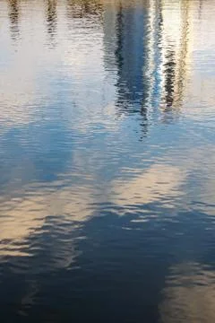 Reflection of clouds and buildings on the water Fotos de archivo