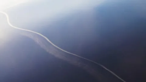 Reflection of clouds and a trace of an airplane Video stock 284529473