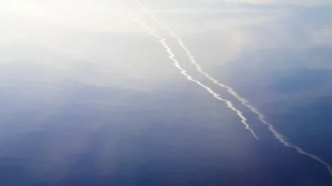 Reflection of clouds and a trace of an airplane Video stock 284529517