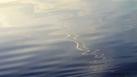 Reflection of clouds and a trace of an airplane Video stock 284529572