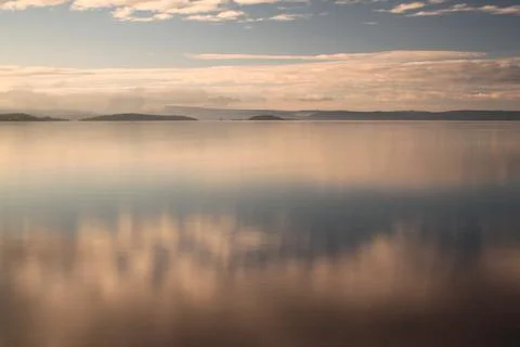 Reflection of clouds in calm water - Lysaker Stock Photos