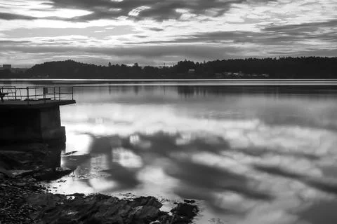 Reflection of clouds in calm water - Lysaker Stock Photos