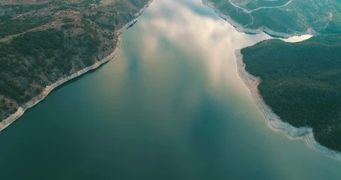 Reflection of clouds is falling in water. Aerial shot of lake Stock Footage 85506786
