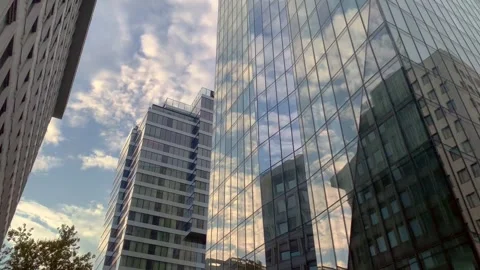 Reflection of clouds in a glass building Timelaps Stock Footage 253817592