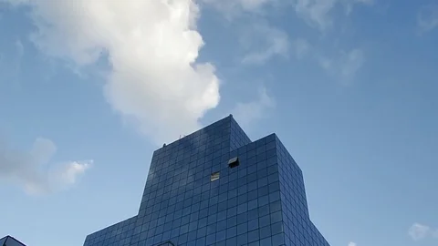 Reflection of clouds in the glass surface of a high-rise building Stock Footage 84827758