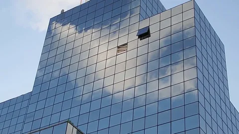 Reflection of clouds in the glass surface of a high-rise building Stock-Footage 84827795